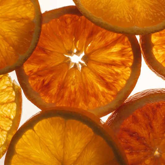 Close-up of sliced oranges with a white background