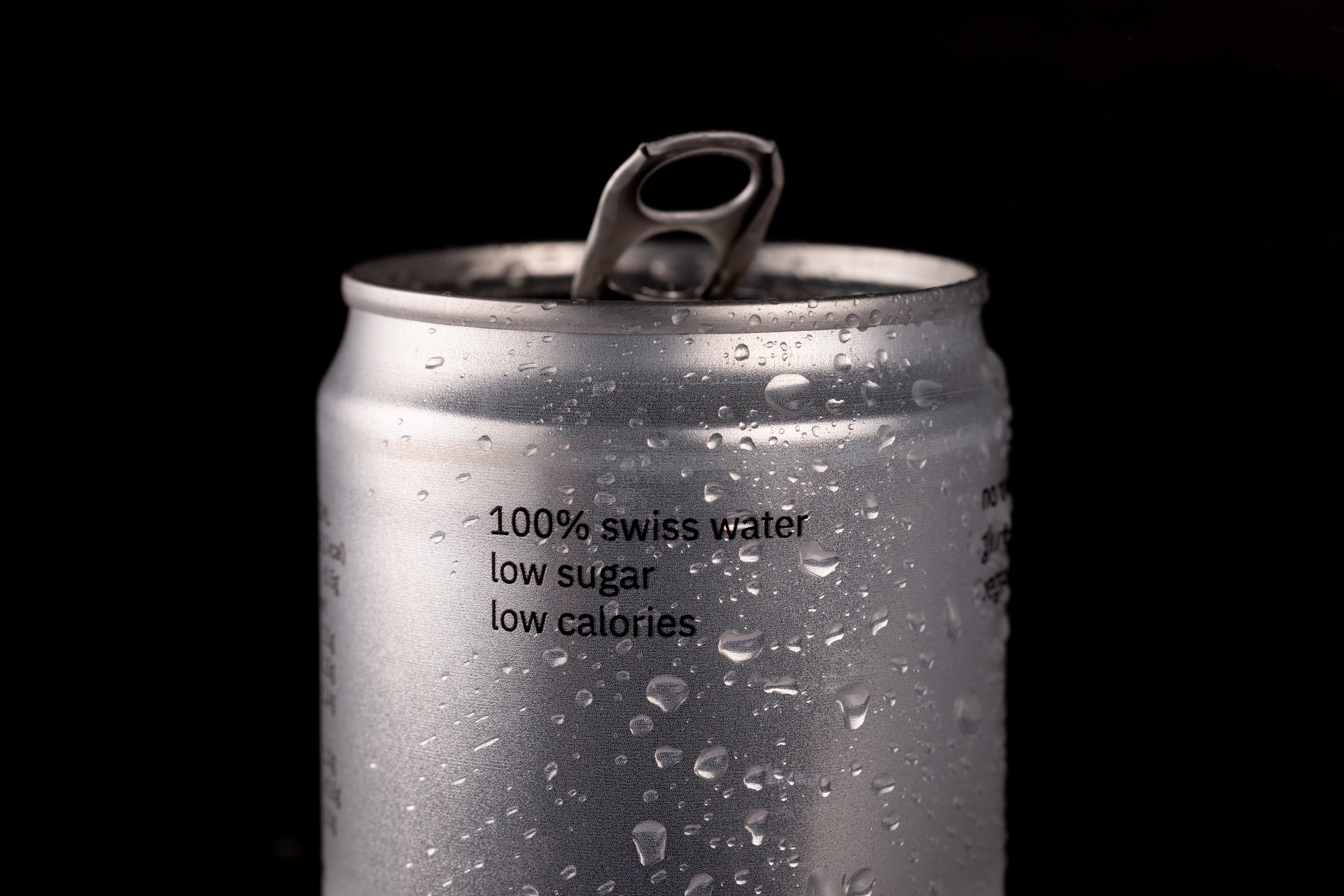 Silver can with text on a black background