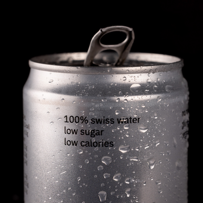 Silver can with water droplets and text on a black background